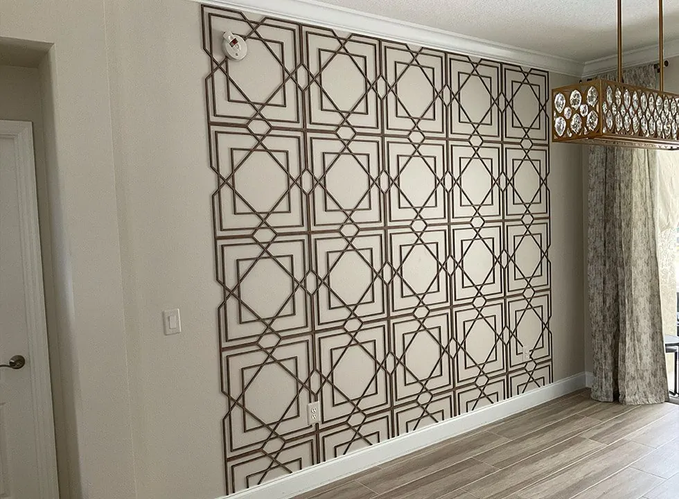 Dining room wall covered in interlocking square and diamond trim molding over painted drywall in Lakewood Ranch, FL